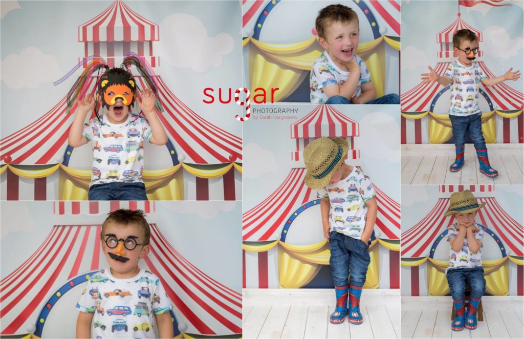 A little boy has circus theme fun in the Sugar Photography studio with costumes, props and a big top backdrop